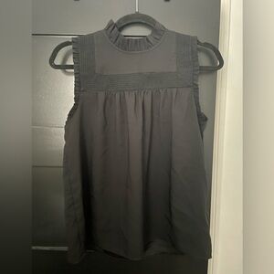 Ann Taylor black shell with smocked neck and ruffle detail
